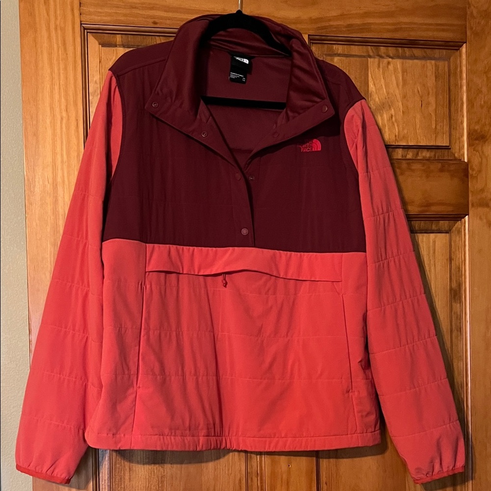 The North Face Women's Two-Tone  Pullover Jacket. Colors are coral and burgundy